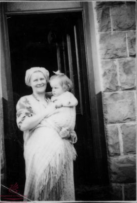 Ada Evans with baby Glynys outside their home in